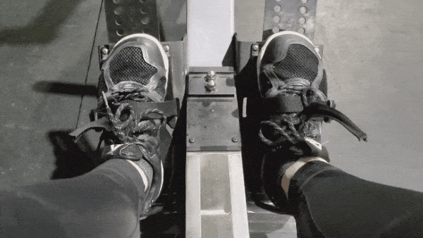 Strapping feet into row machine